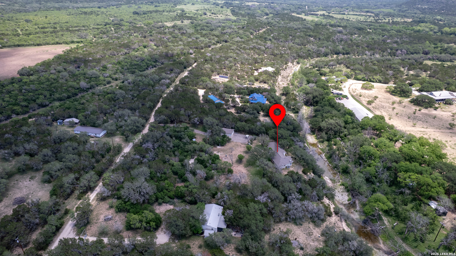 270 Robinson Road Concan, TX 78838 - Photo 40 of 50 an aerial view of house with yard and mountain view