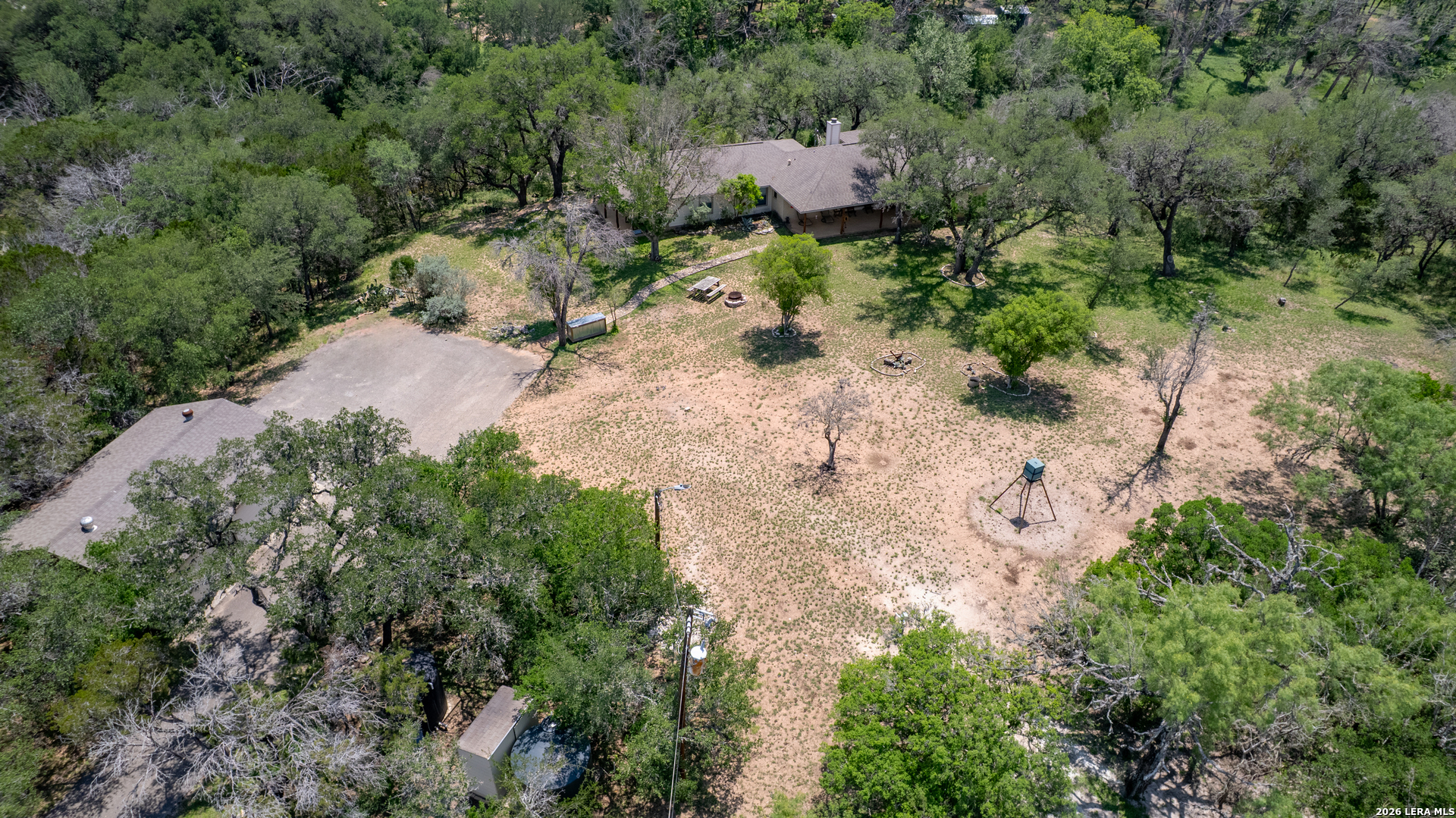 270 Robinson Road Concan, TX 78838 - Photo 49 of 50 an aerial view of a house with a yard