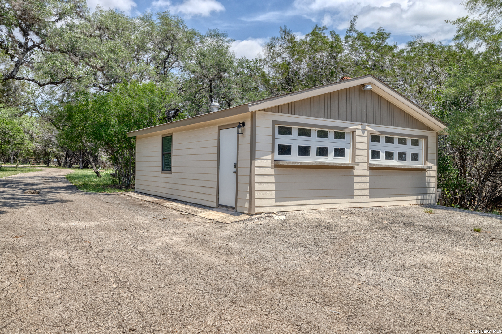 270 Robinson Road Concan, TX 78838 - Photo 5 of 50 front view of a house with a yard