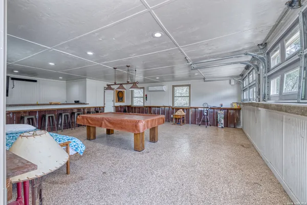 a room with lots of furniture and a table