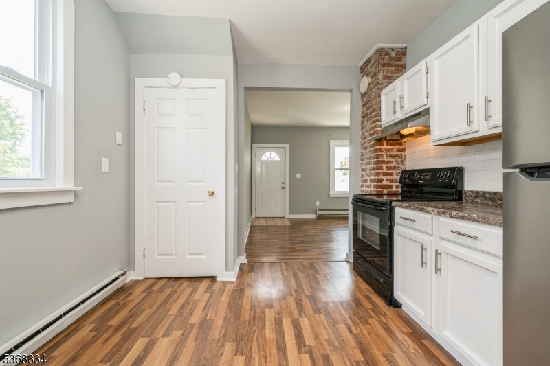 97 Allen Street, Unit 2 Netcong, NJ 07857 - Photo 11 of 29 a view of a kitchen with wooden floor and electronic appliances