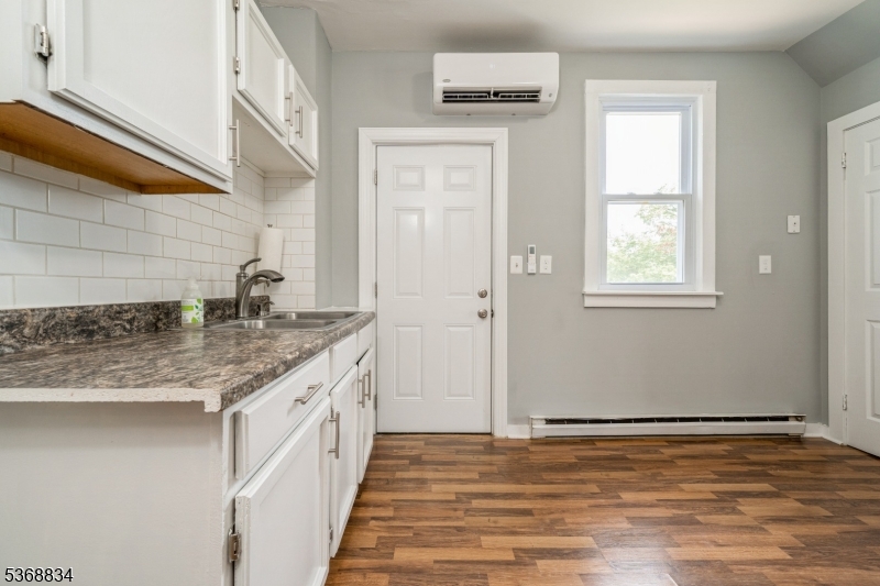 97 Allen Street, Unit 2 Netcong, NJ 07857 - Photo 12 of 29 a bathroom with a granite countertop sink and a window