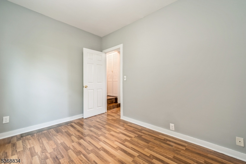 97 Allen Street, Unit 2 Netcong, NJ 07857 - Photo 15 of 29 a view of empty room with wooden floor
