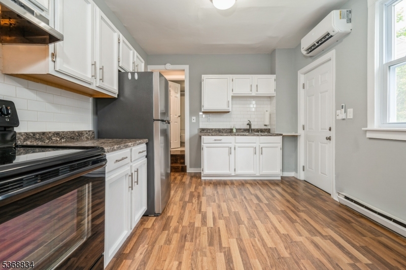 97 Allen Street, Unit 2 Netcong, NJ 07857 - Photo 8 of 29 a kitchen with stainless steel appliances granite countertop a stove a sink and a refrigerator