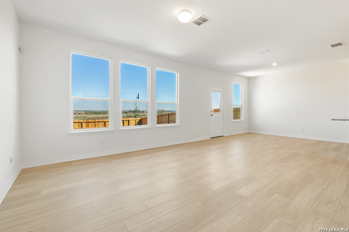 10045 Jagger Avenue Converse, TX 78109 - Photo 11 of 28 a view of an empty room with glass door