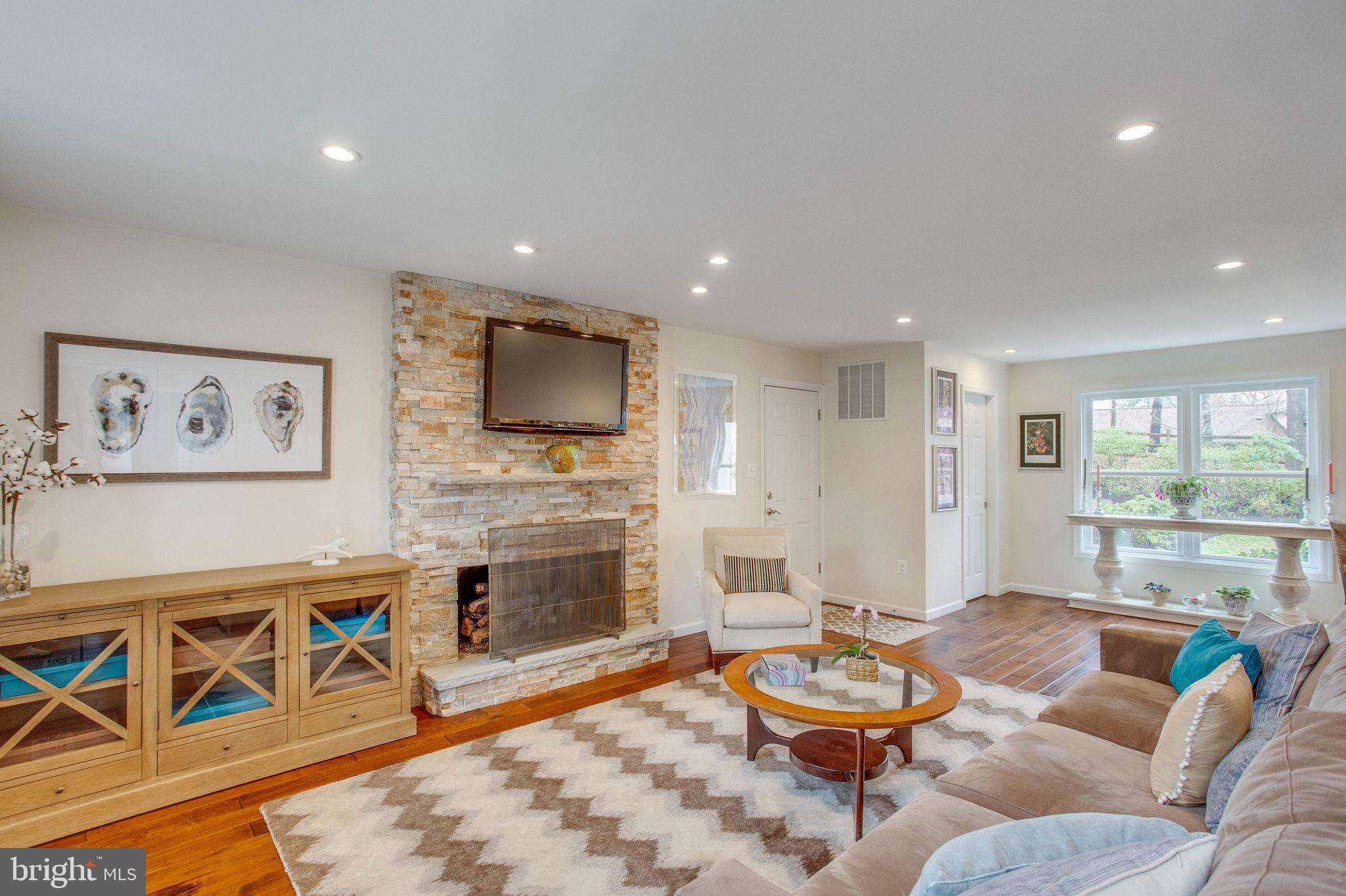 9027 Edgepark Road Vienna, VA 22182 - Photo 17 of 77 Great room w/stacked stone fireplace & mantle