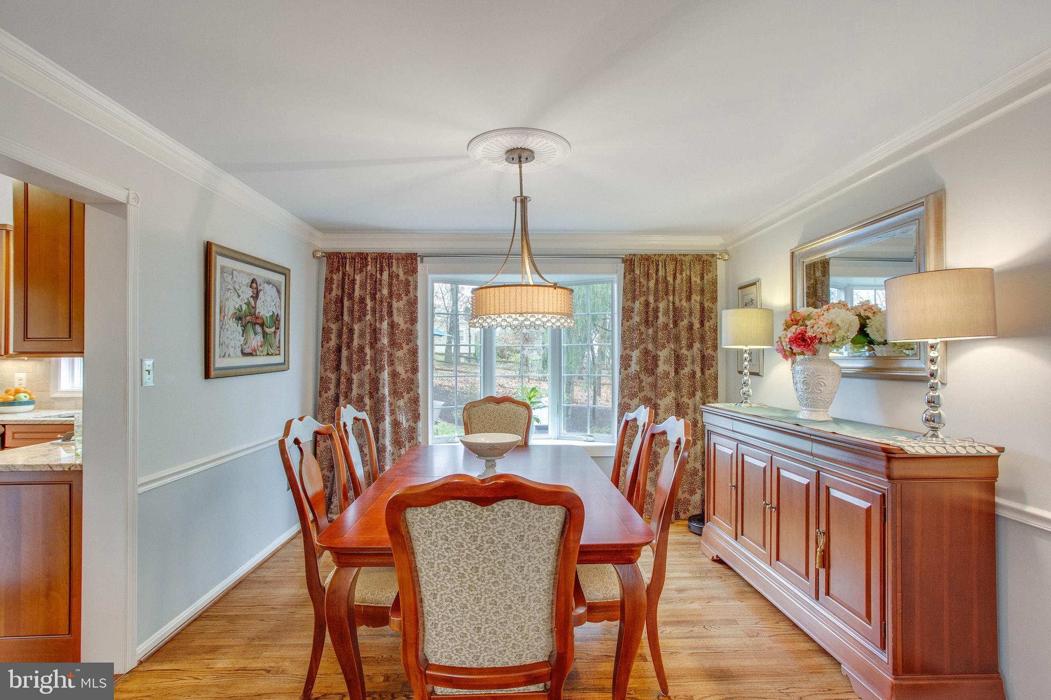 9027 Edgepark Road Vienna, VA 22182 - Photo 24 of 77 Crown moldings & chair rail in dining room