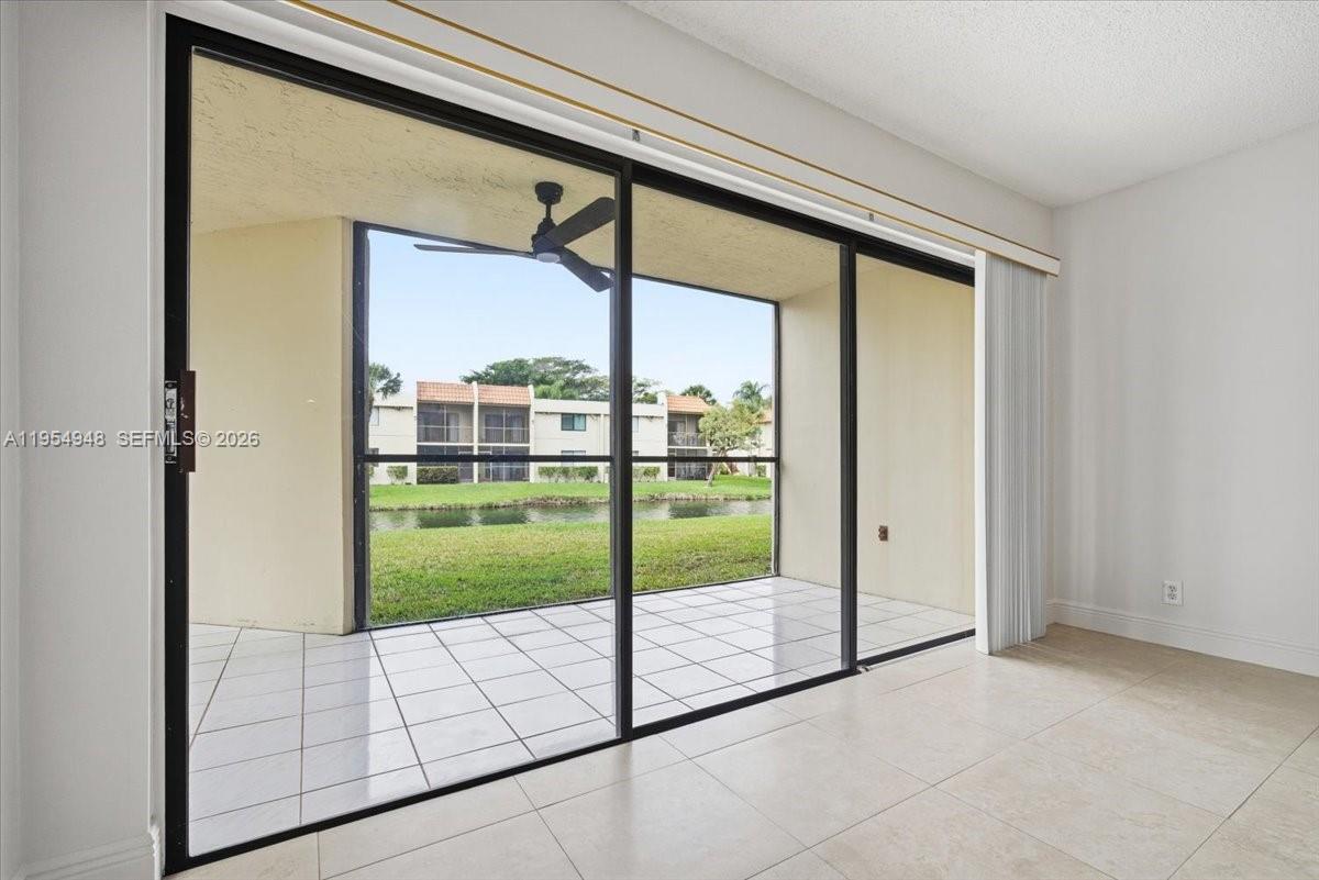 491 Racquet Club Road, Unit 107 Weston, FL 33326 - Photo 23 of 34 a view of an empty room and window