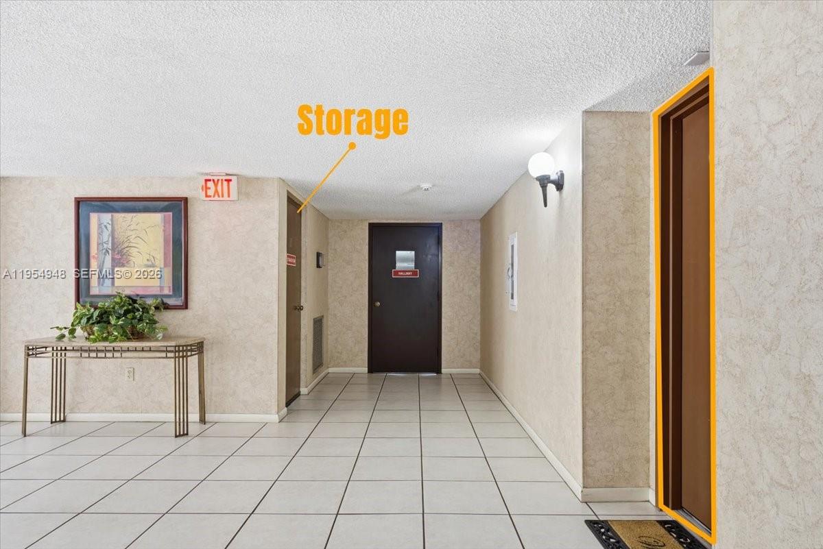 491 Racquet Club Road, Unit 107 Weston, FL 33326 - Photo 5 of 34 a view of an entryway with a hallway