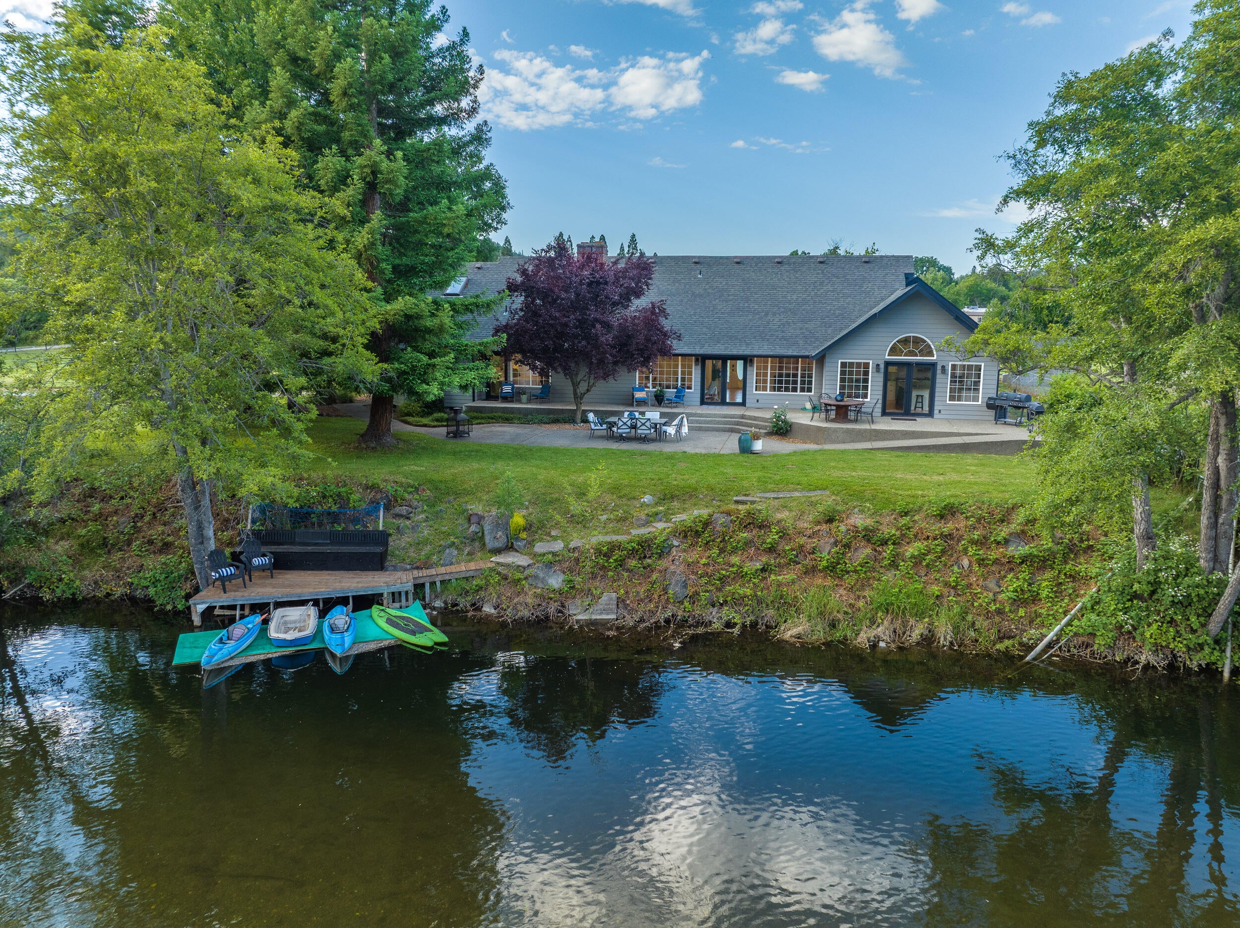 8442 New Hope Road Grants Pass, OR 97527 - Photo 51 of 84 View of the back of the house from over the river