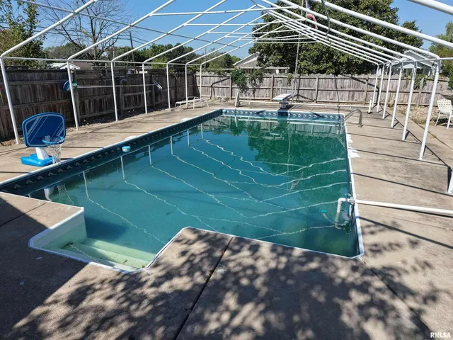 a view of a backyard with sitting area