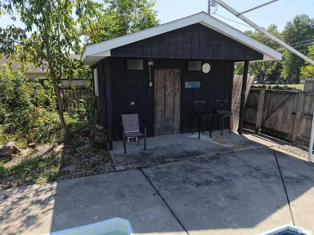 a view of house with backyard