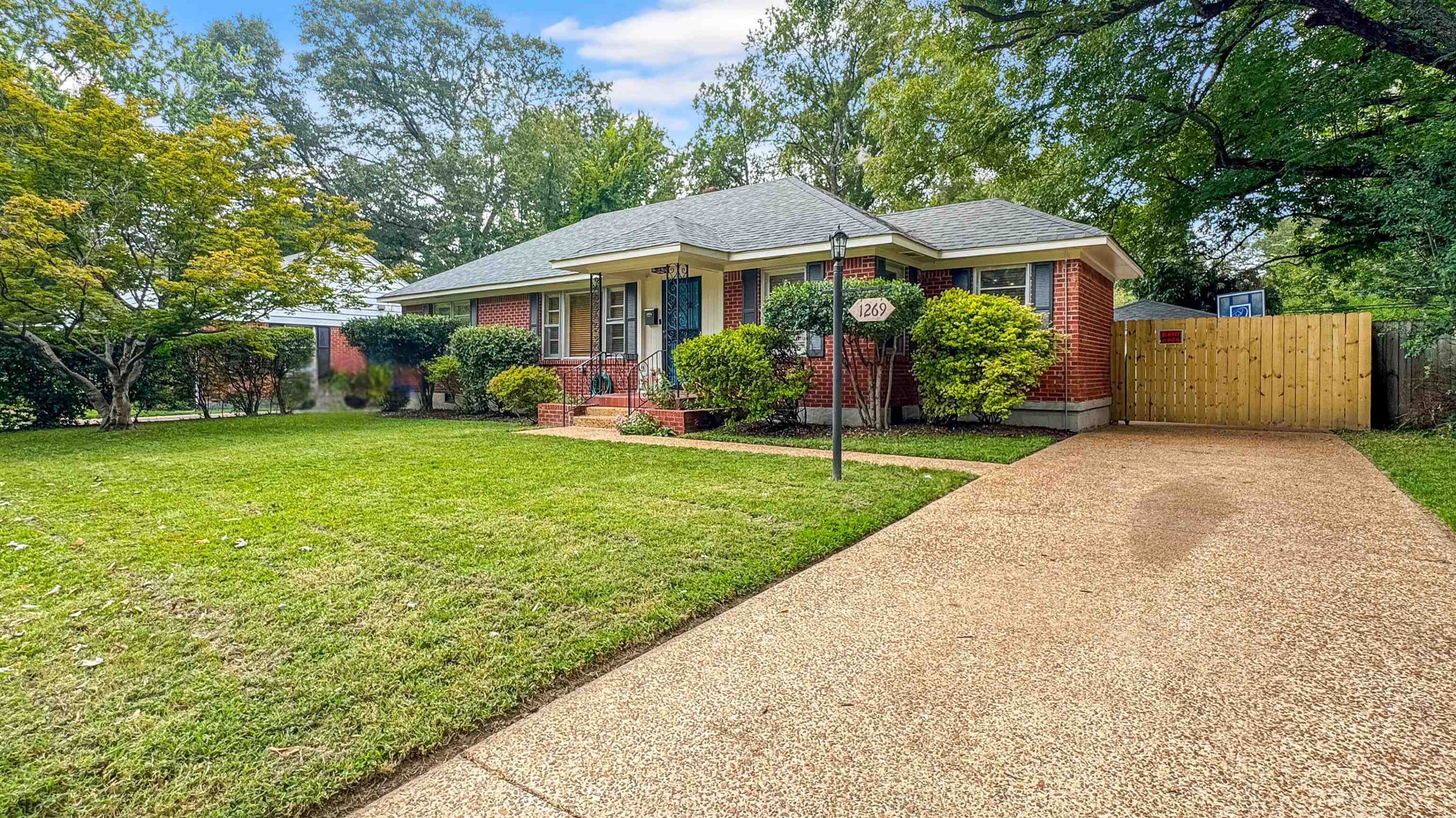 1269 Marcia Road Memphis, TN 38117 - Photo 1 of 27 a front view of a house with a yard