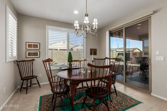 a spacious bathroom with a granite countertop sink a mirror and a
