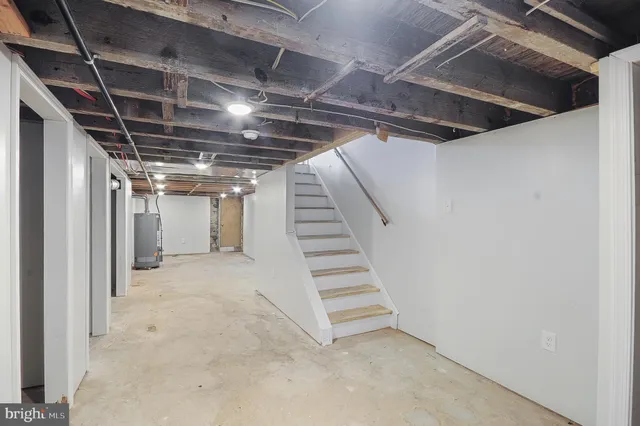 a view of staircase and utility room
