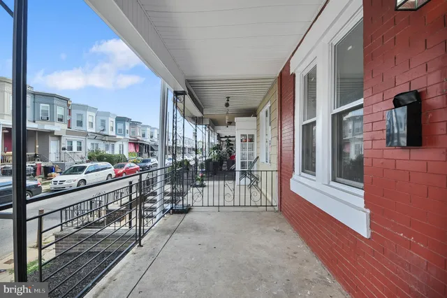 a view of a balcony with city