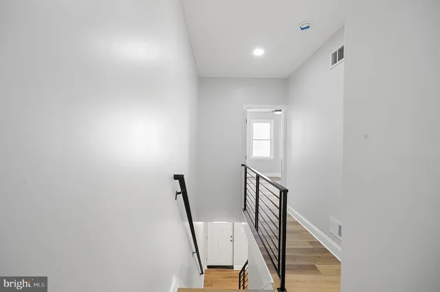 a view of a hallway with staircase