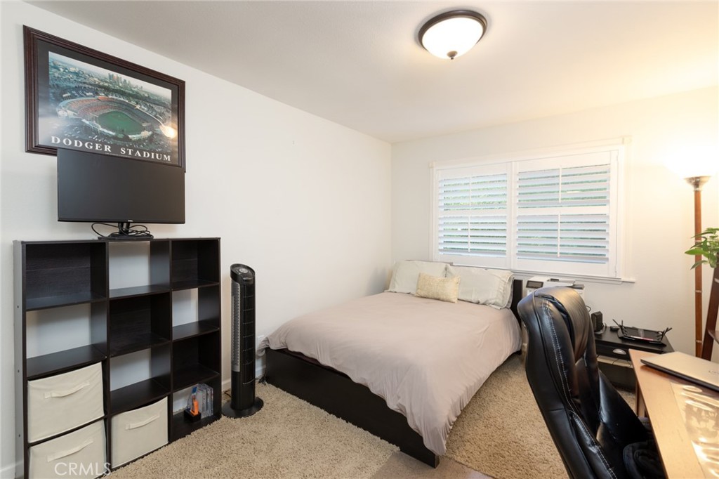 484 Traverse Drive Costa Mesa, CA 92626 - Photo 12 of 30 a bedroom with a bed and a desk