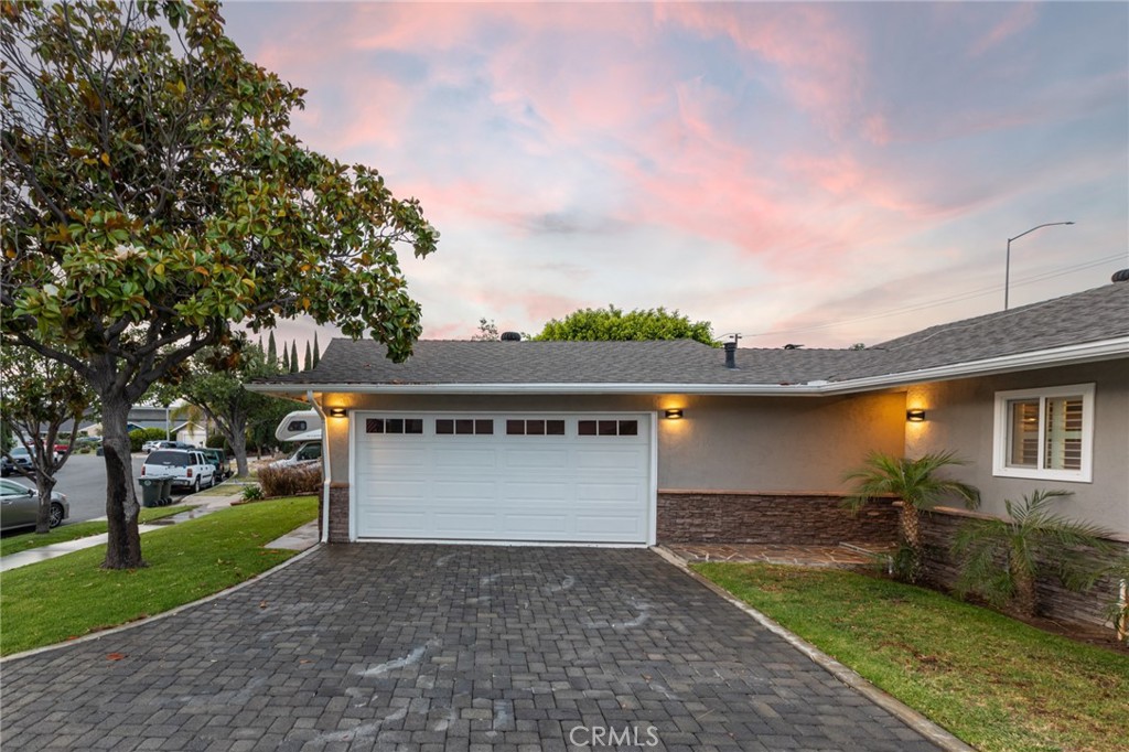 484 Traverse Drive Costa Mesa, CA 92626 - Photo 4 of 30 a front view of a house with a yard and garage