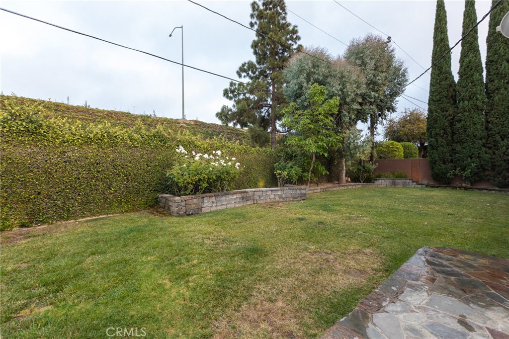 484 Traverse Drive Costa Mesa, CA 92626 - Photo 9 of 30 a view of a big yard with a house