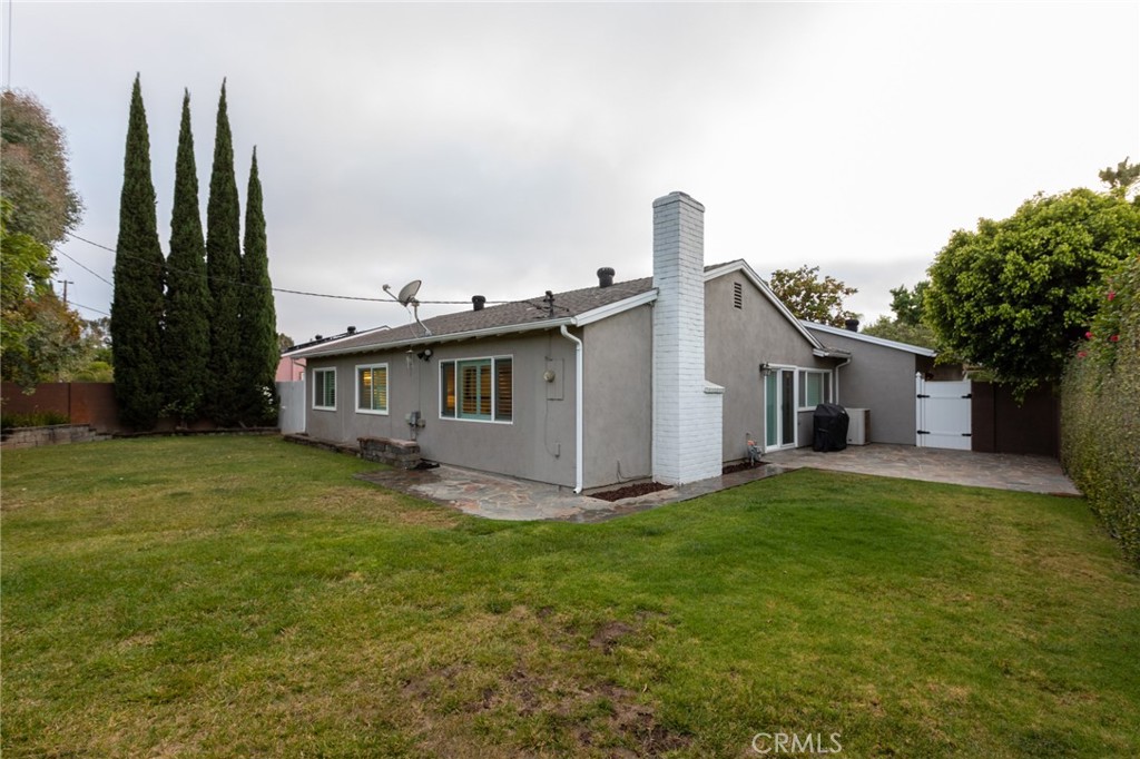 484 Traverse Drive Costa Mesa, CA 92626 - Photo 10 of 30 a view of a yard in front of a house with a large tree