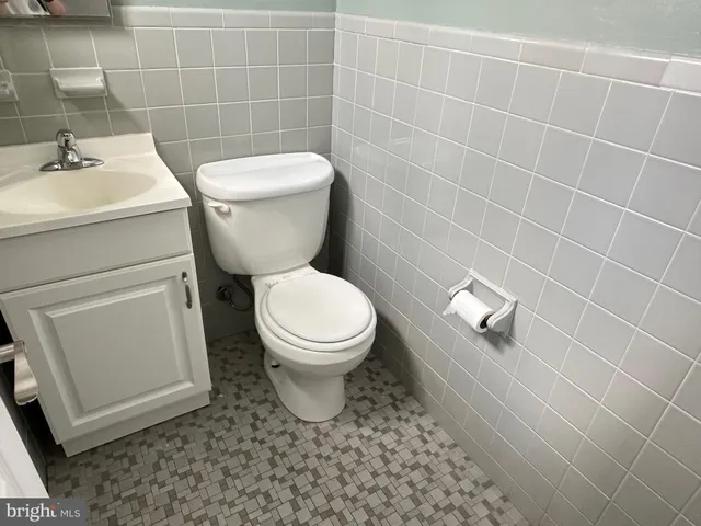 a bathroom with a toilet and a sink