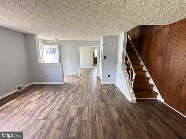 a view of entryway with wooden floor