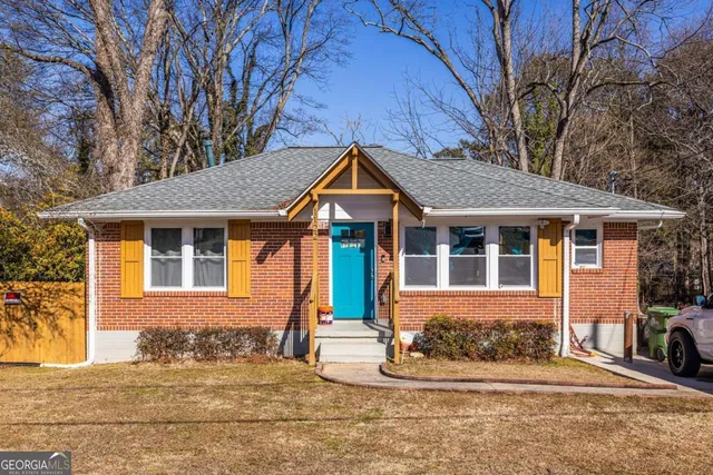 a front view of a house with a yard