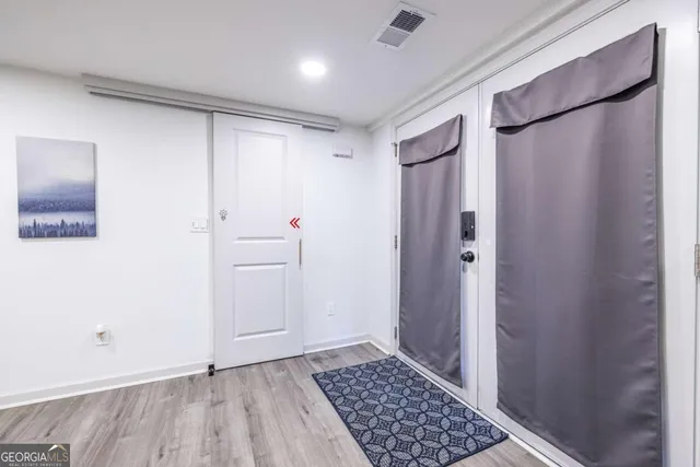 a bathroom with a shower and a sink