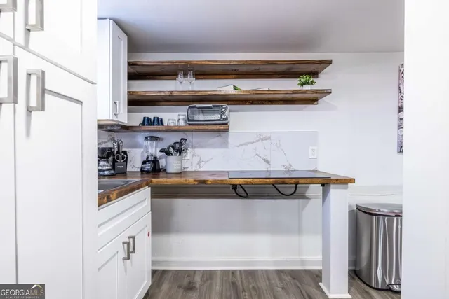 a view of cabinets with wooden floor
