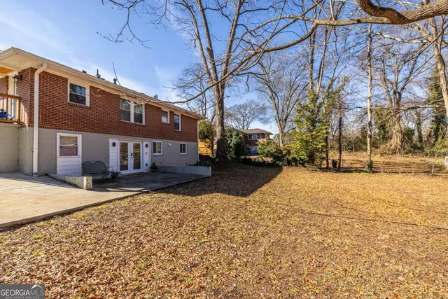 a street view with large trees