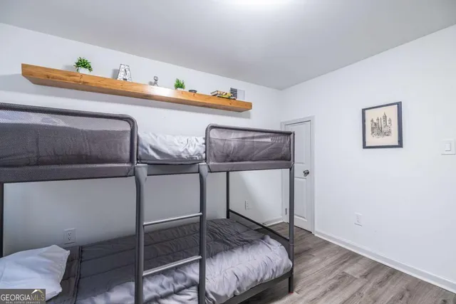 a kitchen with a refrigerator and cabinets