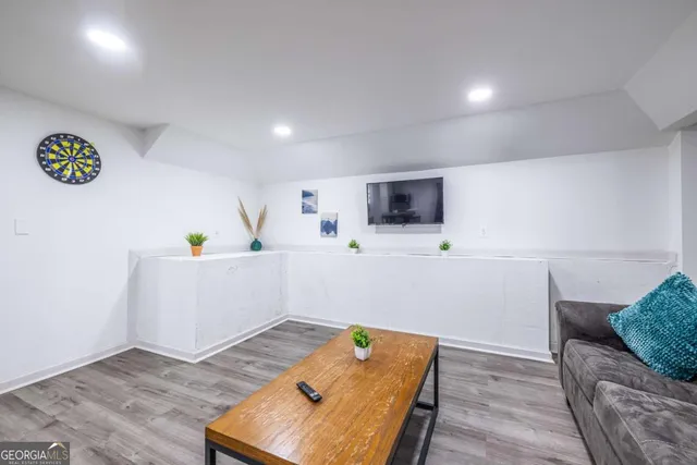 a room with furniture and a wooden floor