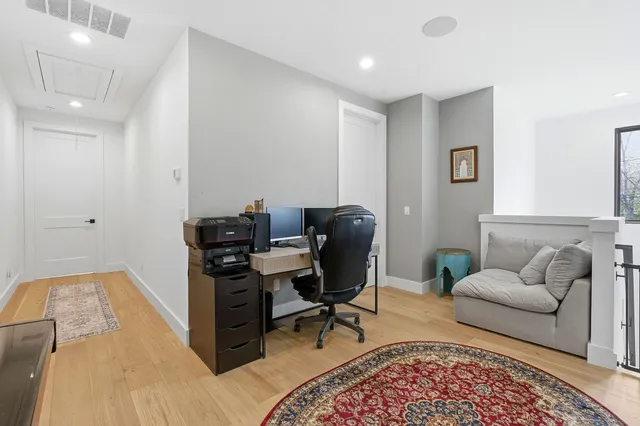a living room with furniture and a rug