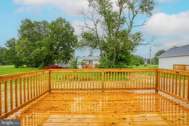a view of a balcony with wooden floor