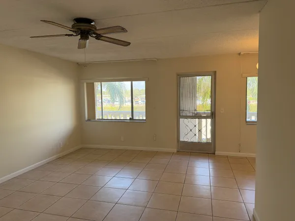 a view of an empty room with a window