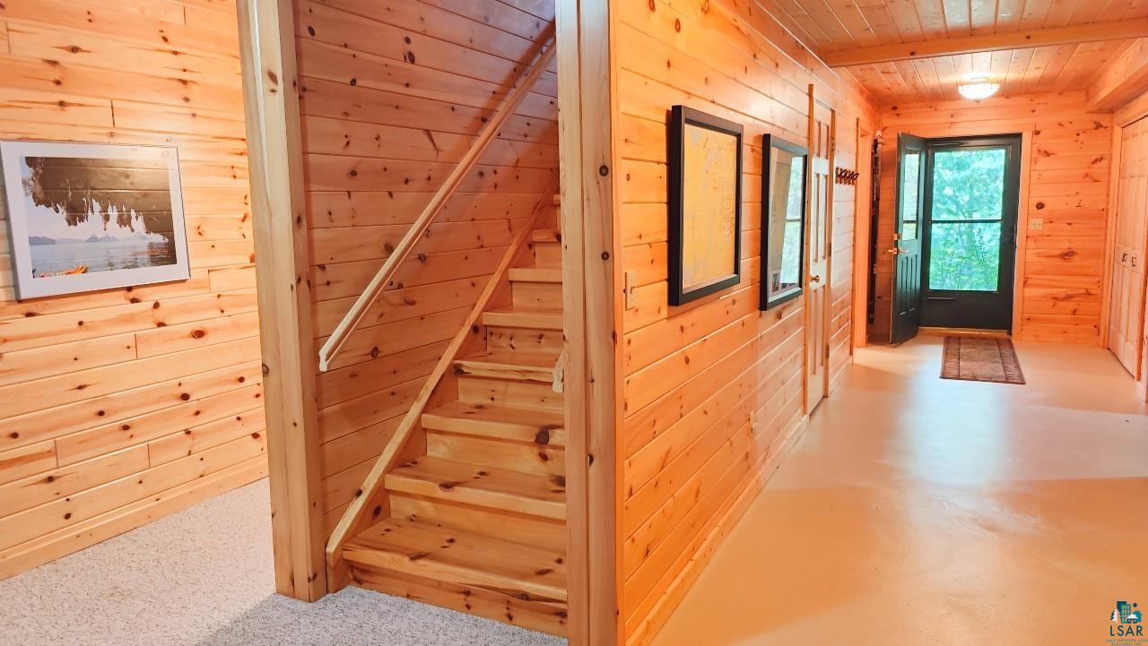 2357 Retreat Lodge Road Cook, MN 55723 - Photo 24 of 60 Stairway with wood walls and wooden ceiling