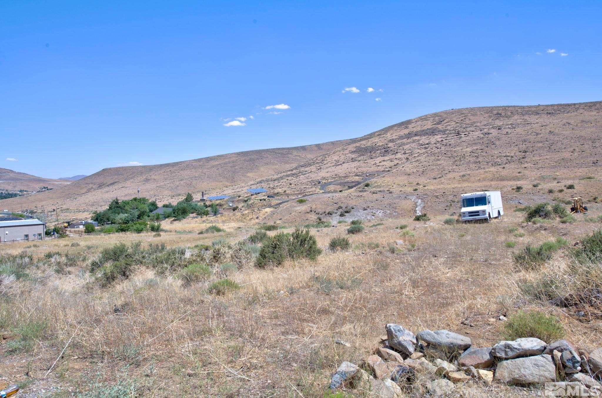 Apn Apn 5017035th, Unit D Reno, NV 89521 - Photo 13 of 14 a view of a dry yard with mountain view