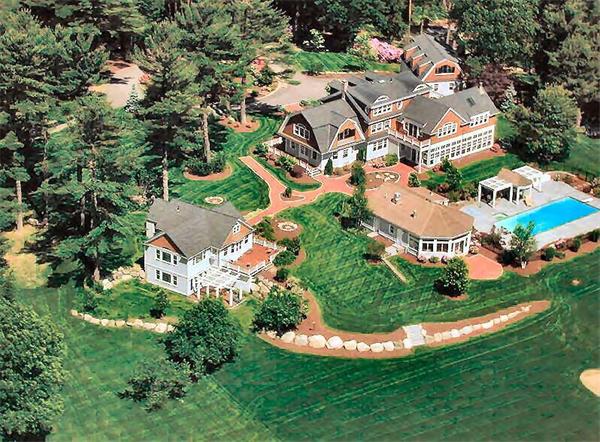 an aerial view of residential house with outdoor space and swimming pool