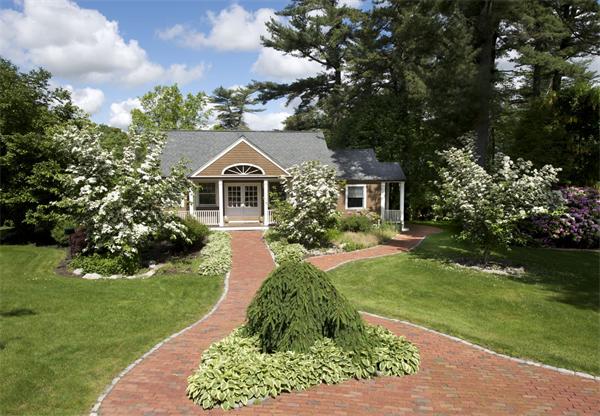 555 Concord Road Sudbury, MA 01776 - Photo 19 of 29 a front view of a house with a yard