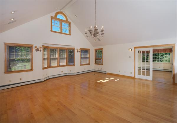 555 Concord Road Sudbury, MA 01776 - Photo 22 of 29 a view of an empty room with a window and wooden floor