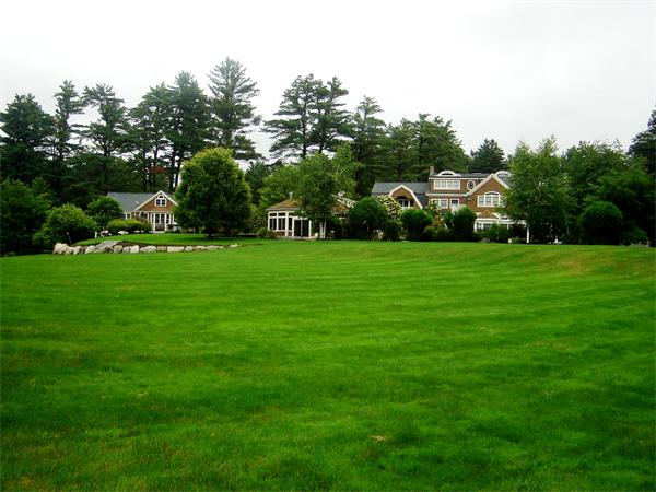 555 Concord Road Sudbury, MA 01776 - Photo 24 of 29 a front view of a house with a yard