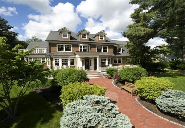 555 Concord Road Sudbury, MA 01776 - Photo 25 of 29 a front view of a house with a garden