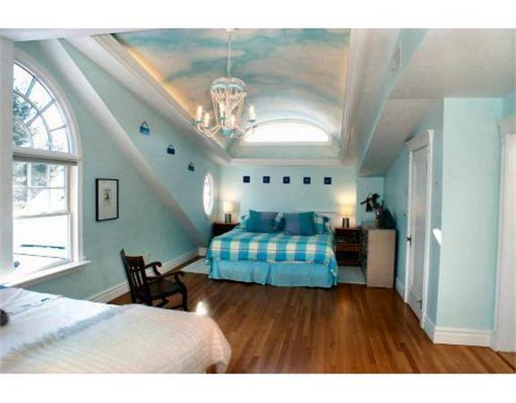 555 Concord Road Sudbury, MA 01776 - Photo 29 of 29 a living room with furniture chandelier and a wooden floor