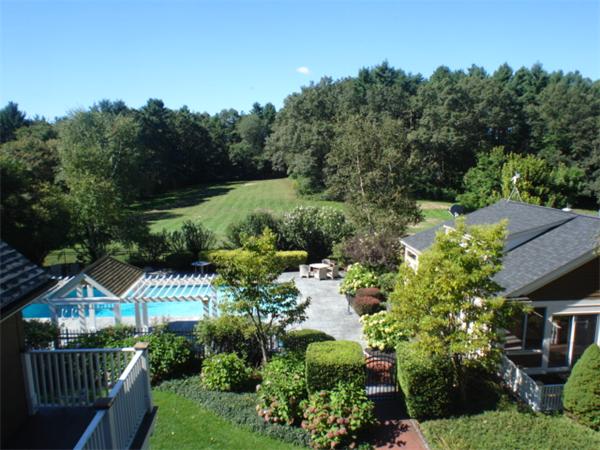 555 Concord Road Sudbury, MA 01776 - Photo 3 of 29 a front view of a house with a yard