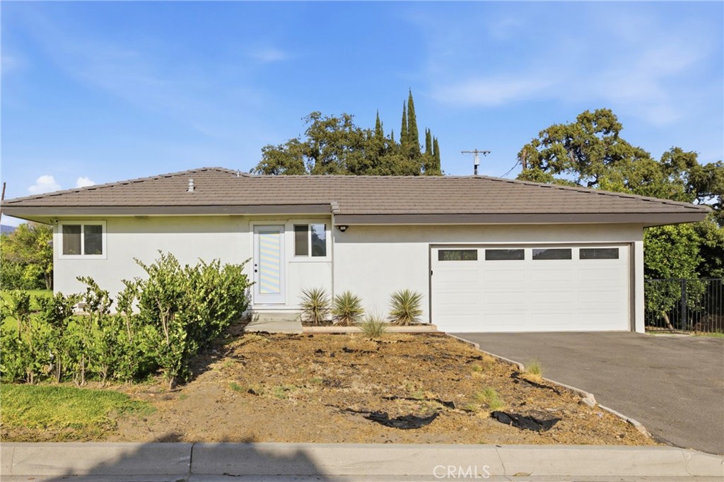 384 Colorado Street Arcadia, CA 91007 - Photo 15 of 51 front view of a house with a yard
