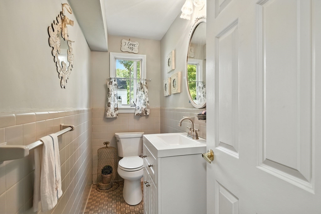 35 Plymouth Road Longmeadow, MA 01106 - Photo 22 of 41 a white toilet sitting next to a bathroom sink and a window