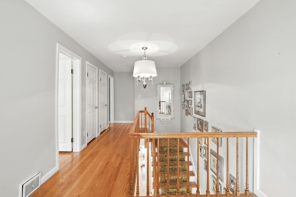 35 Plymouth Road Longmeadow, MA 01106 - Photo 24 of 41 a view of a chandelier fan and wooden floor