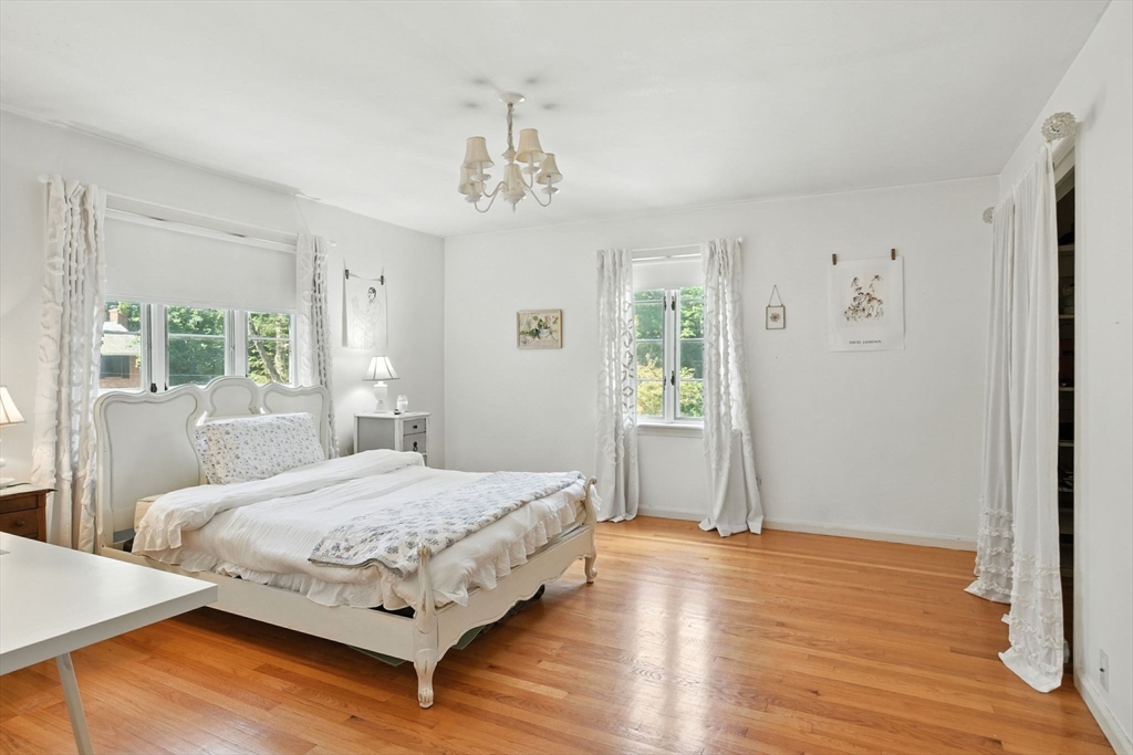35 Plymouth Road Longmeadow, MA 01106 - Photo 31 of 41 a bedroom with a large bed wooden floor and window