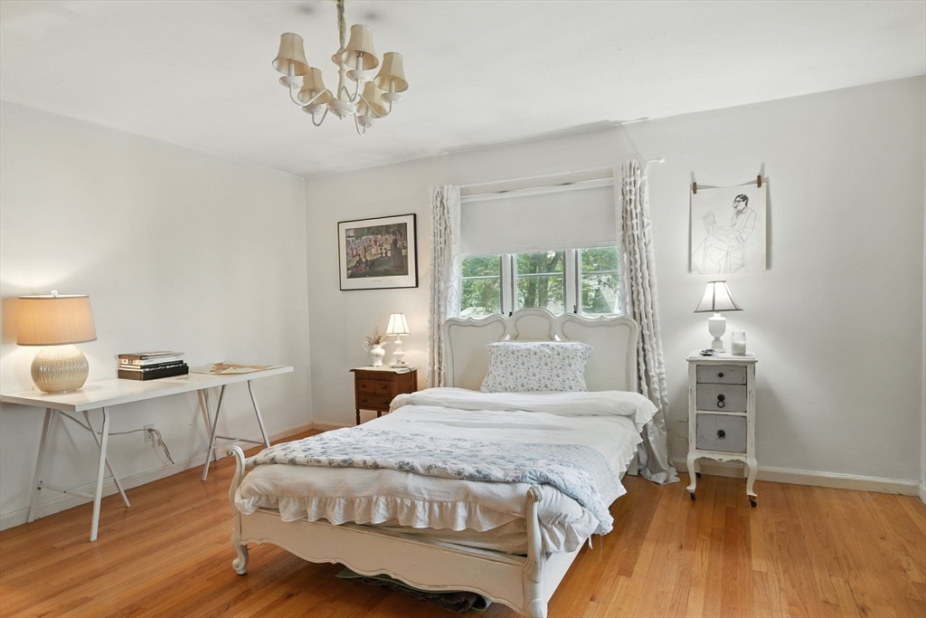 35 Plymouth Road Longmeadow, MA 01106 - Photo 32 of 41 a bedroom with a bed and a table in it